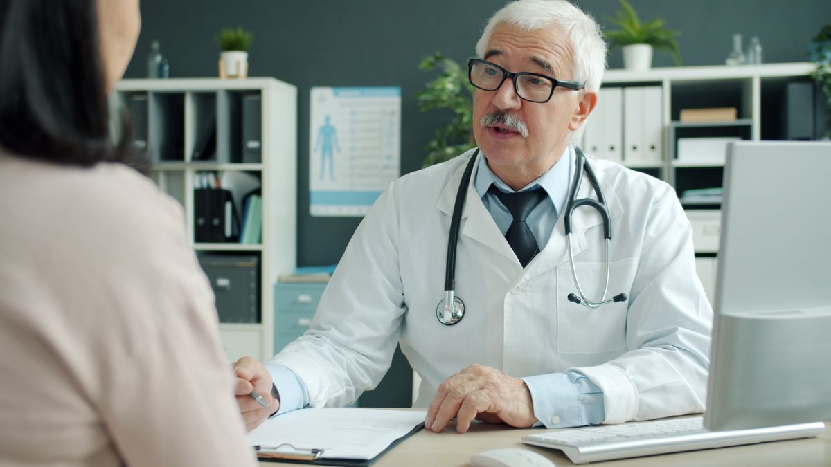 A physician reviewing results with a patient in a community health center