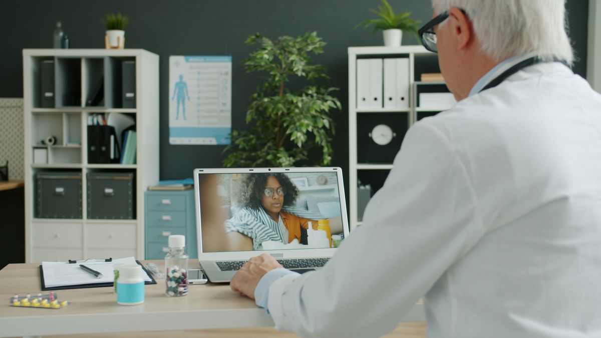 A cardiologist reviewing a study on a video call